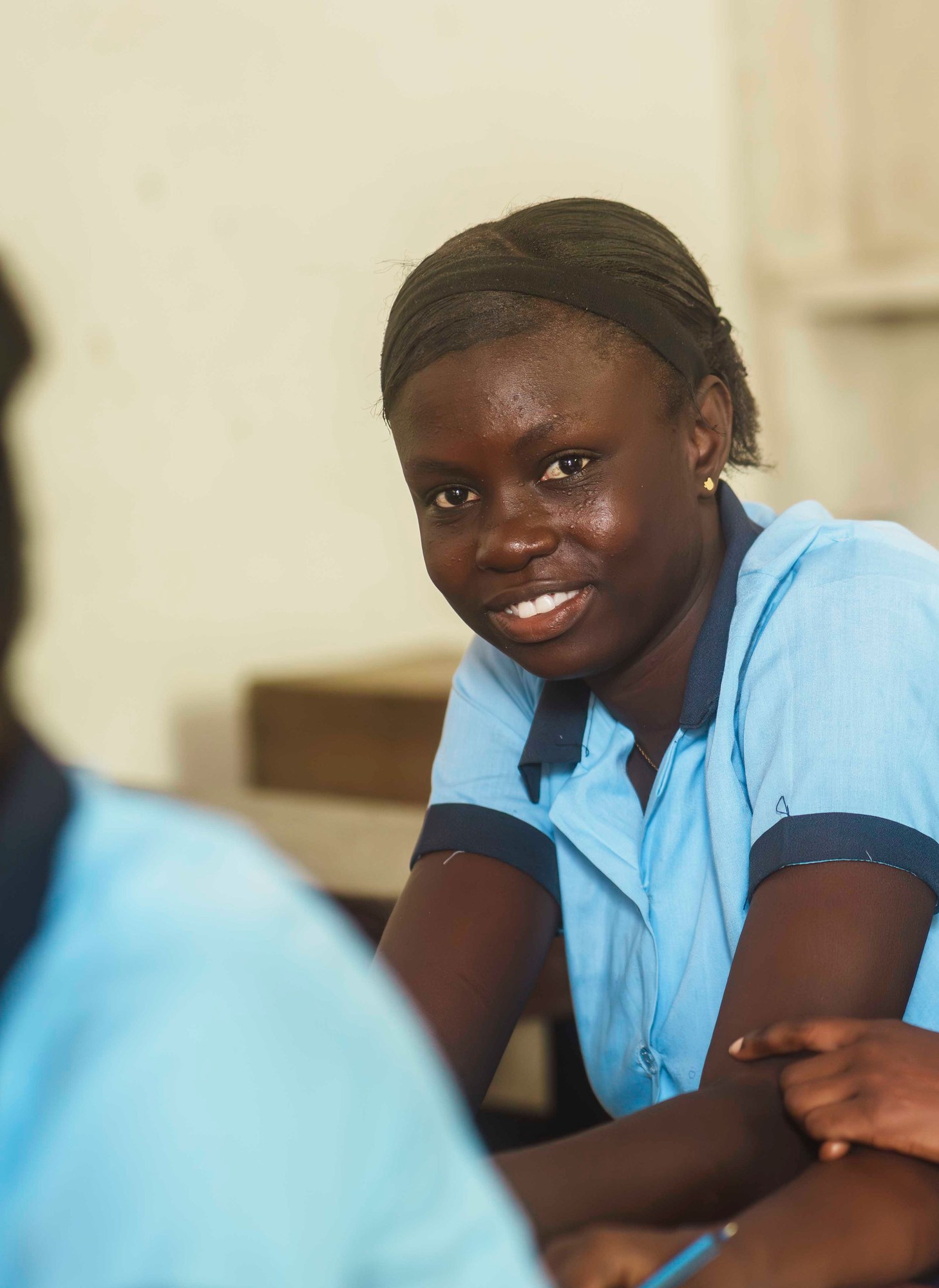 A student working at a classroom desk